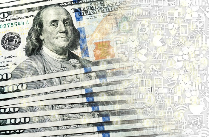 $100 bills transforming into digital currency